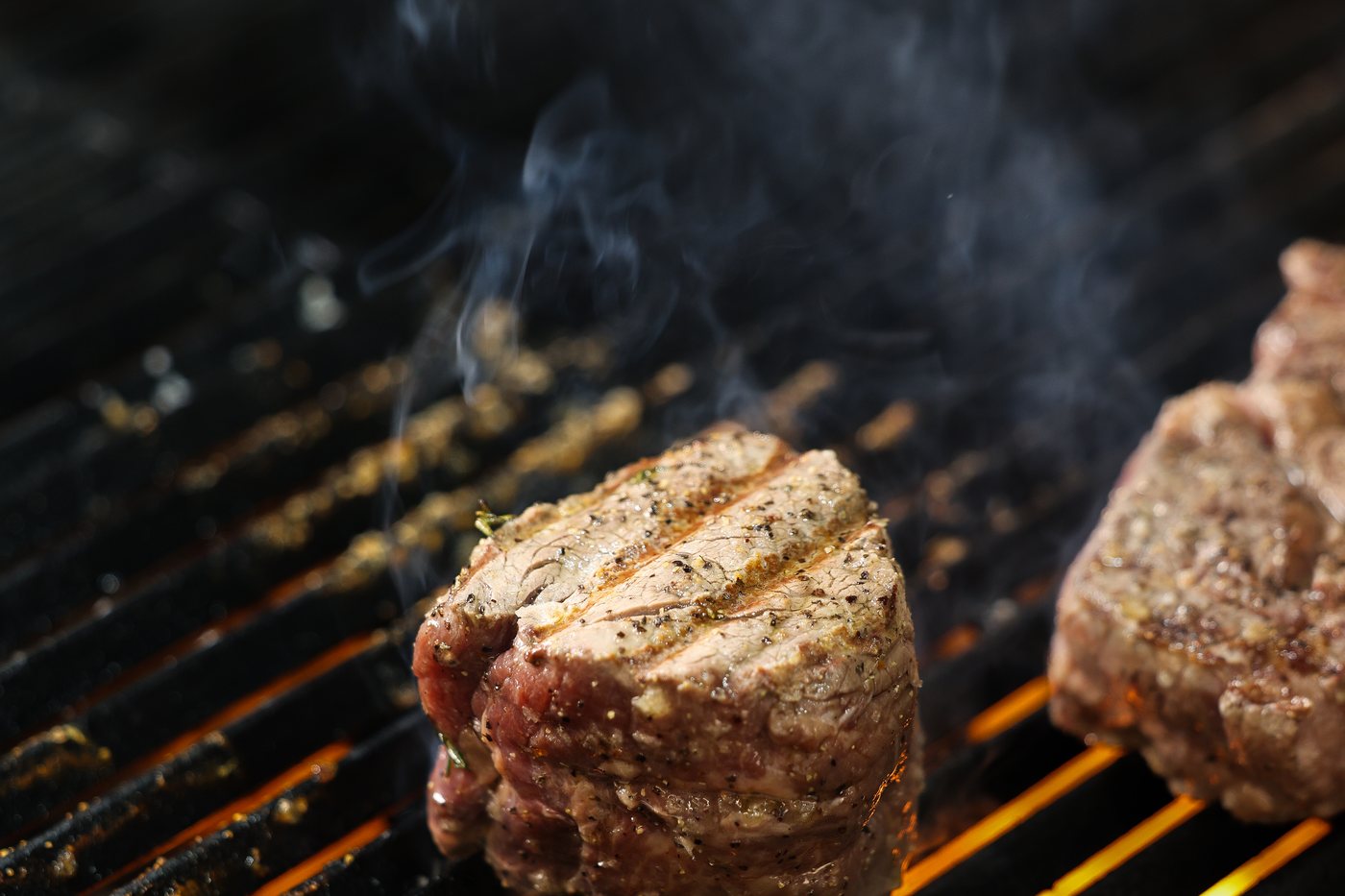 Steaks over the charcoal grill